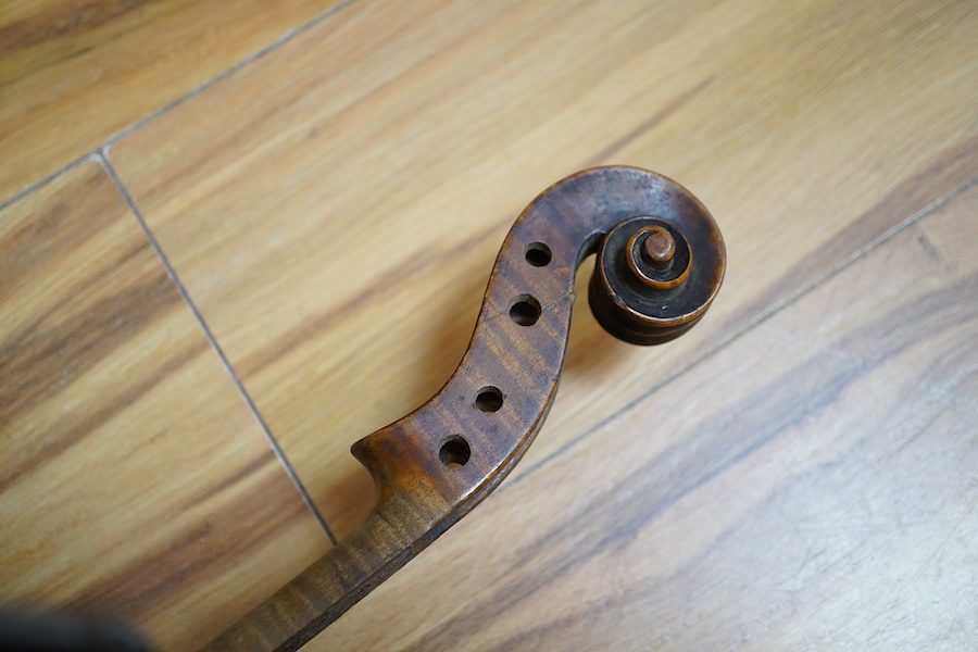 A quantity of violin parts and violins, a ukelele, a double bass scroll, a pinfold metronome, a violin case by Hill, a viola etc. Condition - for restoration